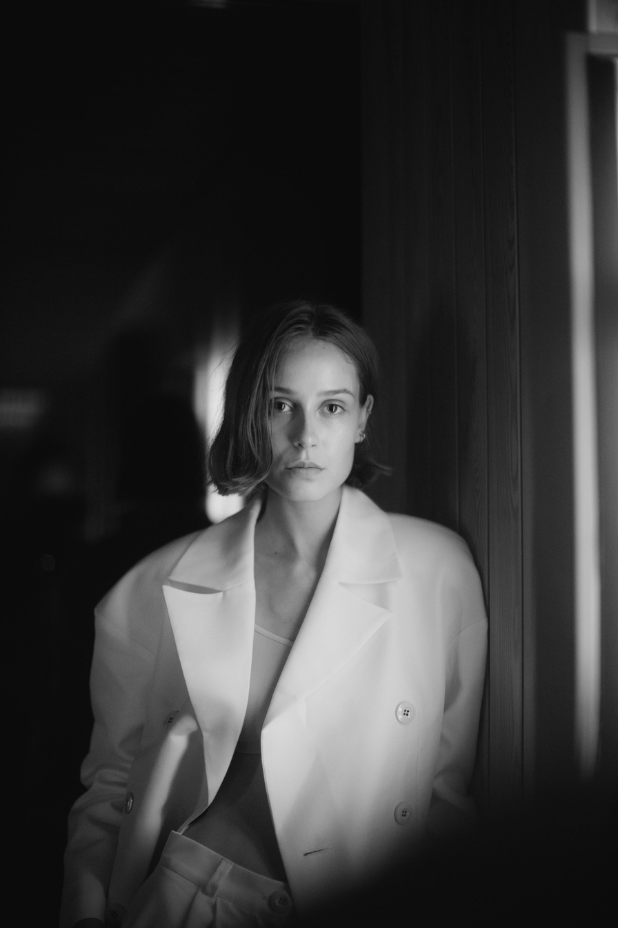 Black and White Photo of a Woman Wearing Blazer