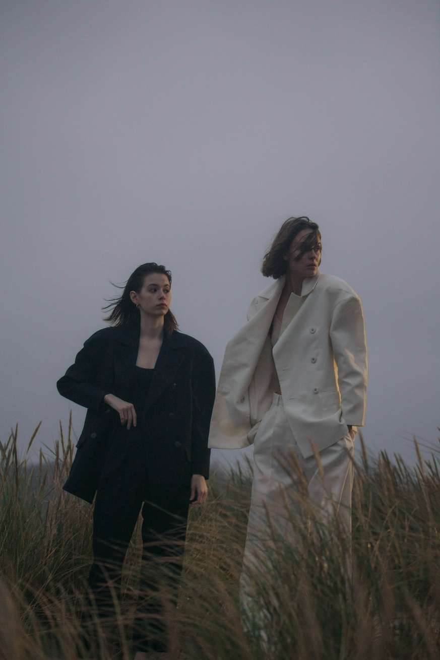 Women Wearing Blazers on a Field