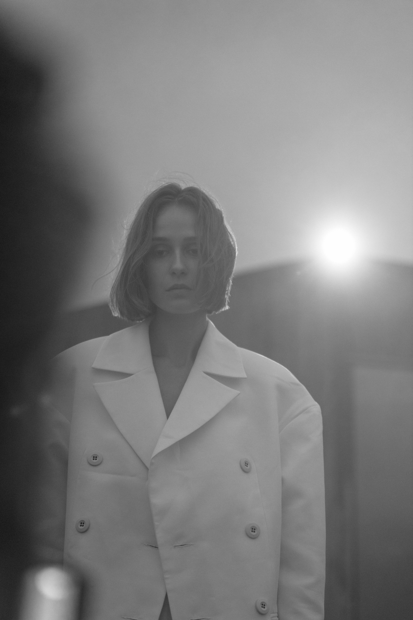 Grayscale Photo of a Woman Wearing White Oversized Blazer 